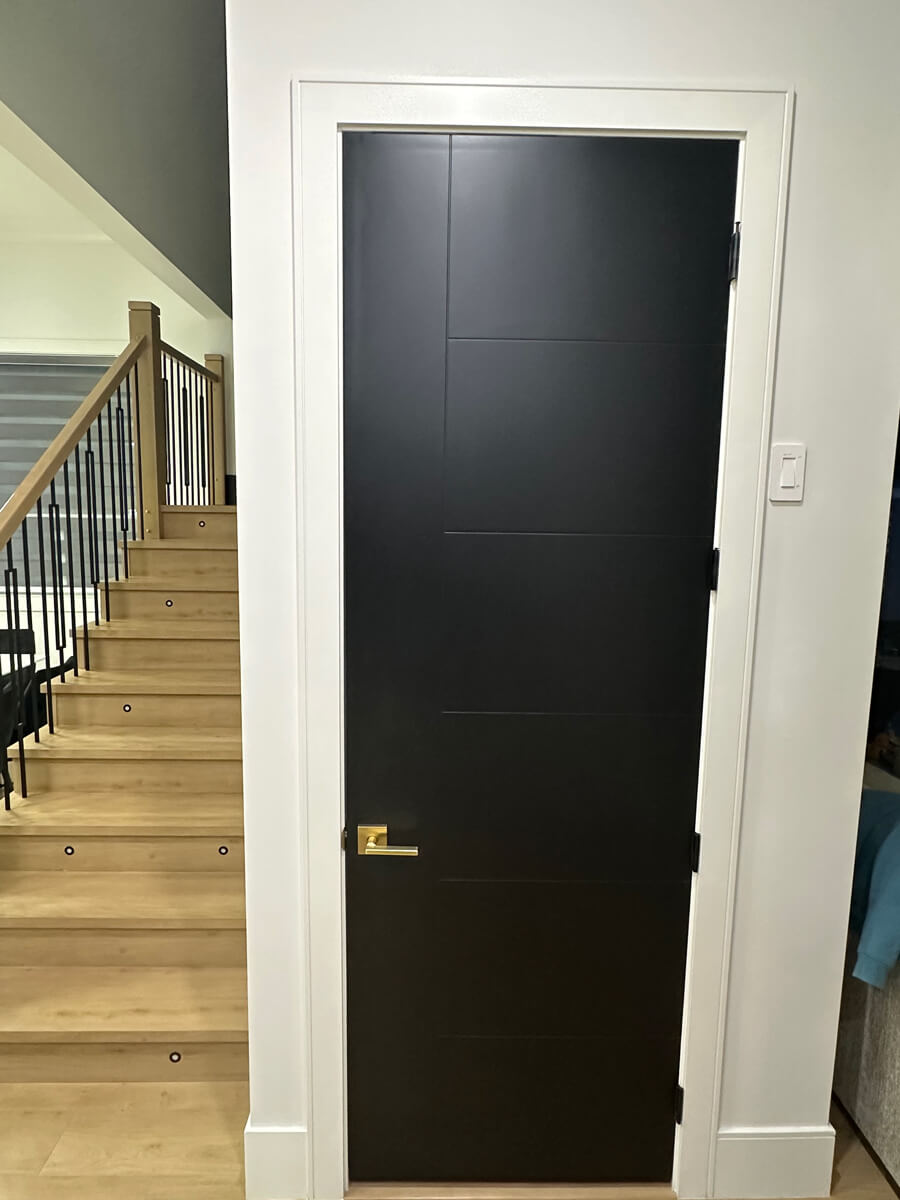 Newly painted black door house interior Oakville, Ontario